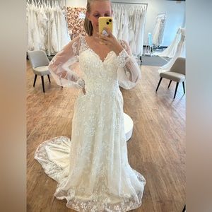 Ivory/Cashmere long sleeve wedding dress. Soft A-line look with detailed beading